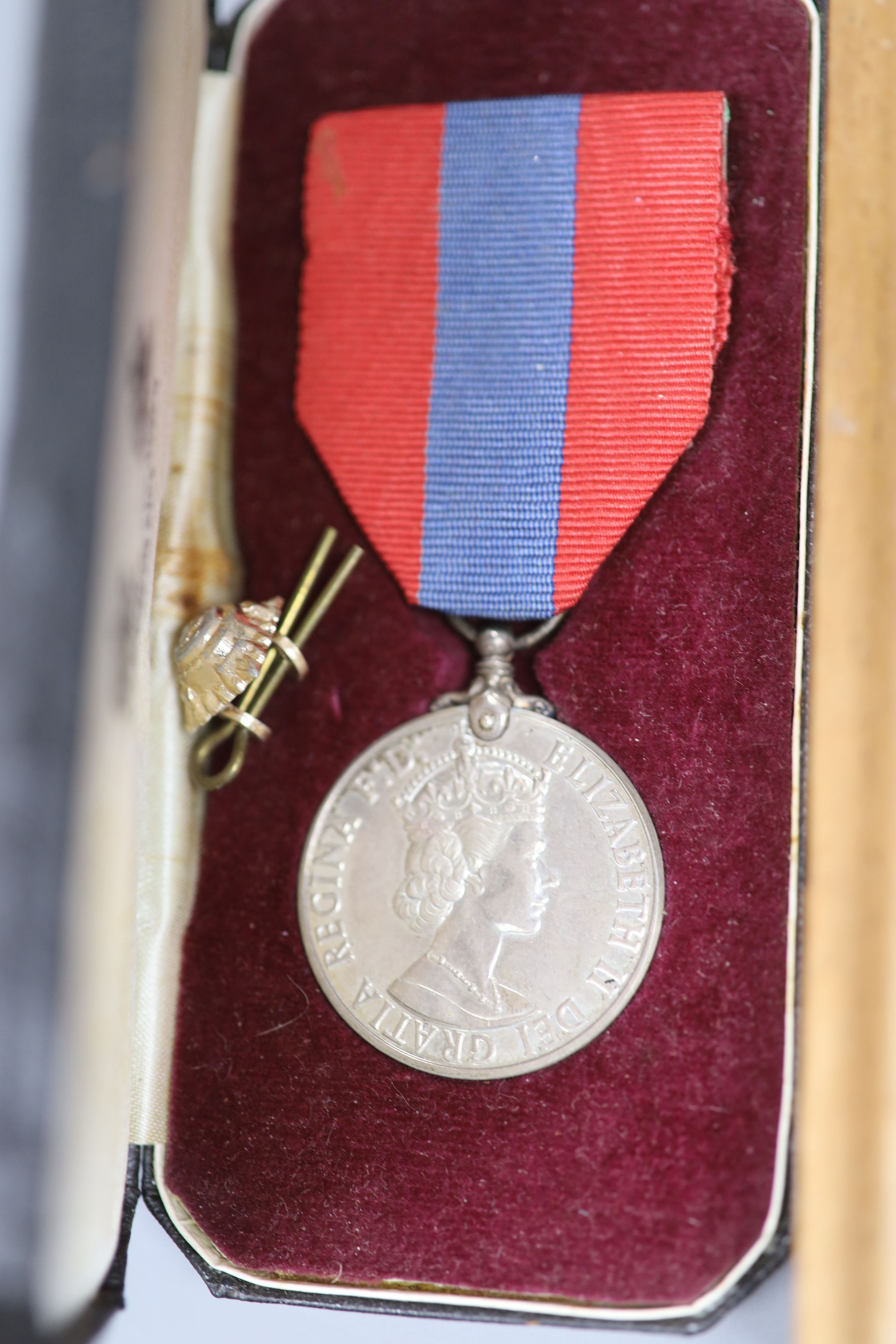 A collection of military medals, badges, coins etc.